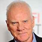 Malcolm McDowell به عنوان Rupert Murdoch