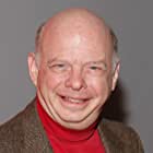 Wallace Shawn به عنوان Rex