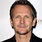 Sebastian Roché به عنوان ThomJerome Newton