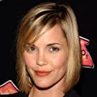 Leslie Bibb به عنوان Susan Rollins