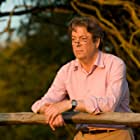 Roger Allam به عنوان Lewis Prothero