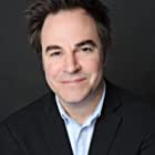 Roger Bart به عنوان Roger Bannister