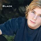 Alex Black به عنوان Young Chris Grandy