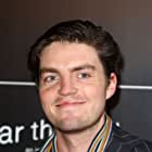 Tom Burke به عنوان Orson Welles