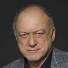 John Doman به عنوان Carmine Falcone