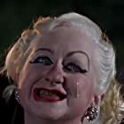 Kim McGuire به عنوان Mona 'Hatchet-Face' Malnorowski