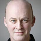 Tim McInnerny به عنوان Calvin