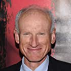 James Rebhorn به عنوان Mr. Trask