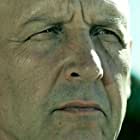 Nick Searcy به عنوان Garland Keith