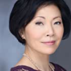 Elizabeth Sung به عنوان Sakamoto's Wife