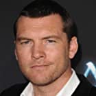 Sam Worthington به عنوان Neil Kelly