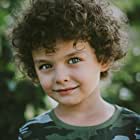 Tamor Kirkwood به عنوان Young Arthur (Three Years Old)