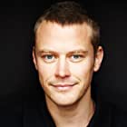 Michael Dorman به عنوان Tom Griffin