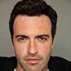 Reid Scott به عنوان Green Arrow