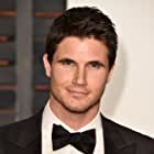 Robbie Amell به عنوان Nathan Brown