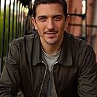 Andrew Schulz به عنوان TJ