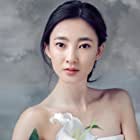 Likun Wang به عنوان Peach Blossom Spirit